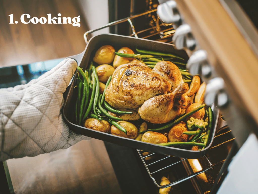 taking roasted chicken and vegetables out of an oven