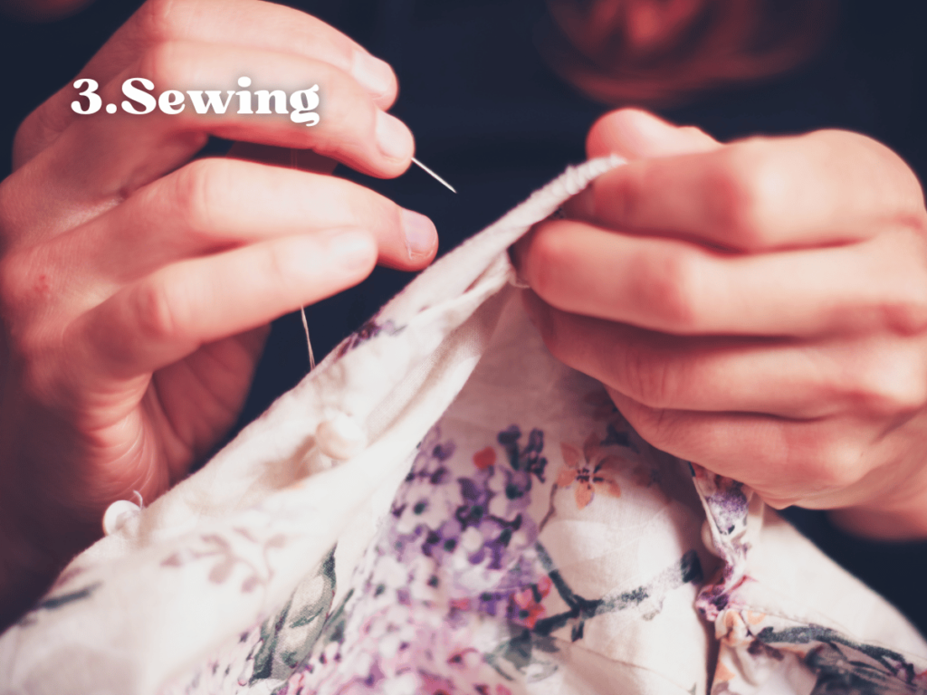 close up of hands sewing